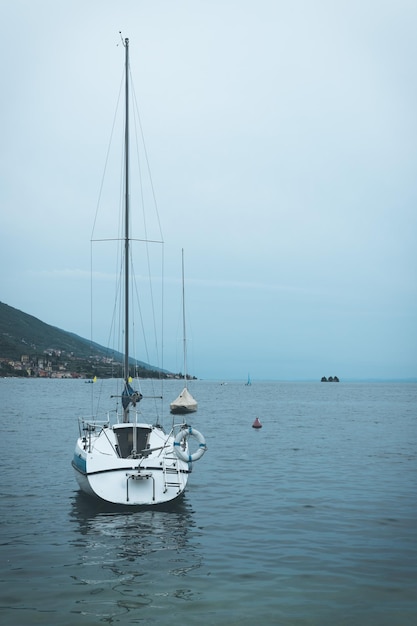 Sail boats and clear blue water Italy gloomy scenery