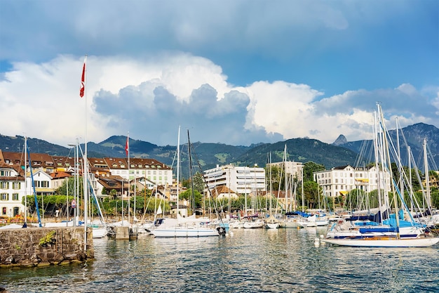 Sail Boats at the quay on Geneva Lake in Vevey, Swiss Riviera.