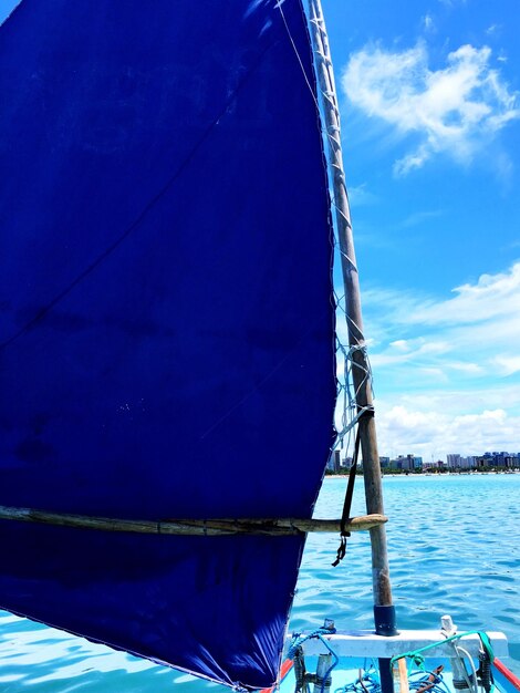 Sailboat in calm blue sea
