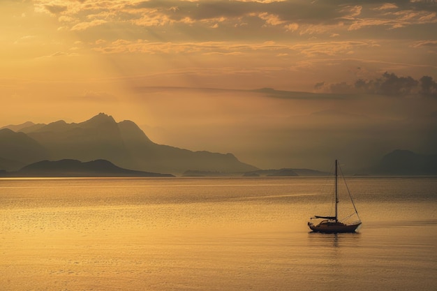 A sailboat floating on a large body of water