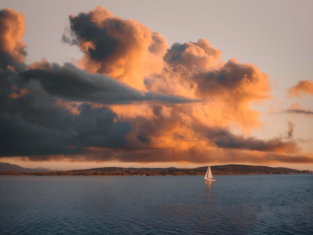 Sailboat on the lake at sunset