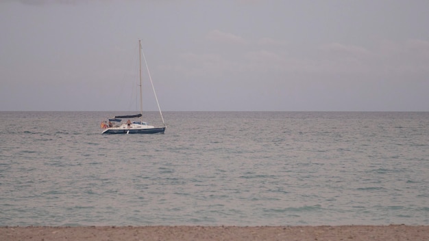 Sailboat sailing a cloudy afternoon in the Mediterranean Sea