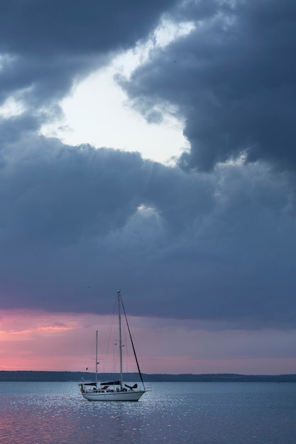 sailboat sailing in sea against sky