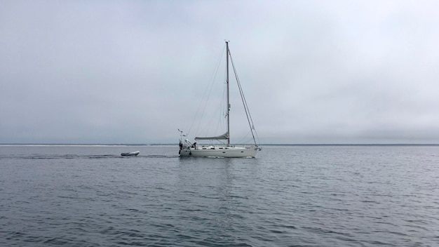 sailboat sailing on sea against sky
