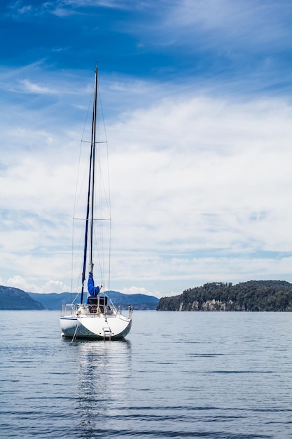 Sailboat sailing on sea against sky