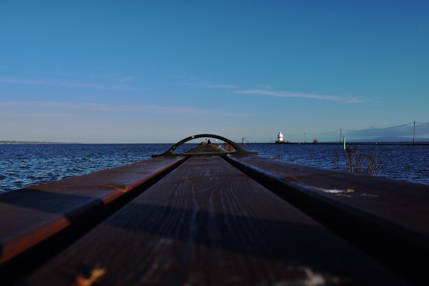 Sailboat on sea against blue sky