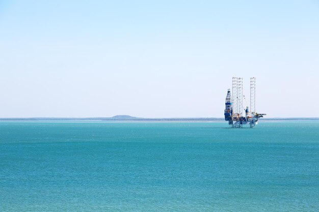 Sailboat in sea against clear sky