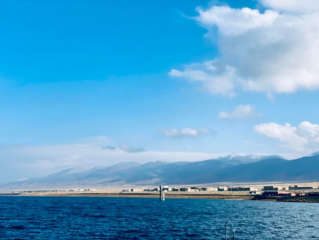 Sailboat in sea against sky qinghai lake