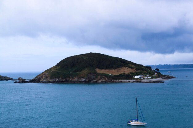 Sailboat on sea against sky