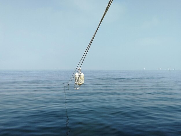 Sailboat on sea against sky