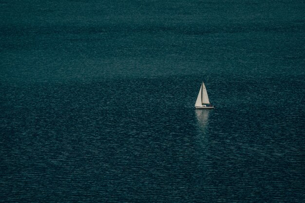 Sailboat symphony harmonizing with the rhythms of the ocean's gentle waves