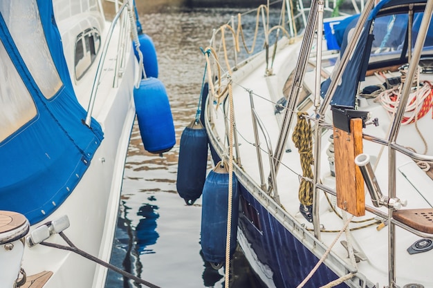 Sailboats on the pier in the yacht club.