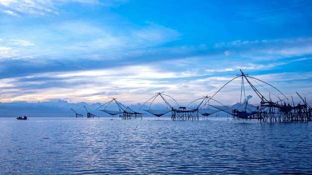 Sailboats in sea against sky