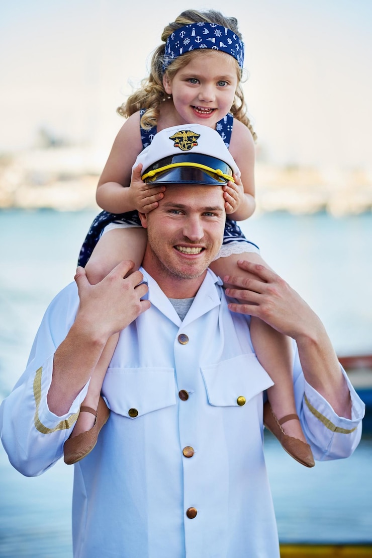 Photo sailor portrait or child at sea with father or captain at ocean for service duty reunion or love at harbour happy shoulders and dad with girl for travel return or patriotic hero family or navy