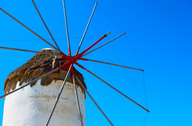 Photo sails of the old windmill in mykonos island in greece