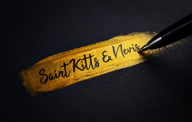 Saint Kitts en Nevis Handschrifttekst op Golden Paint Brush Stroke