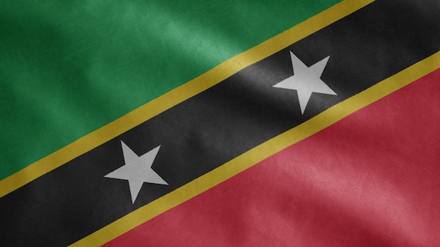 Saint Kitts en Nevis vlag zwaaien op wind. Kittitian en Nevisian banner waait, zachte en gladde zijde. Doek stof textuur vlag
