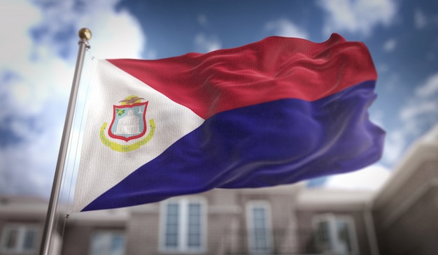 Saint Martin Flag 3D Rendering on Blue Sky Building Background 