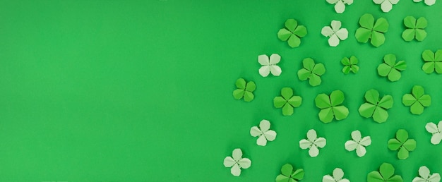 Saint Patrick's day banner with origami clovers leaves Holiday symbol