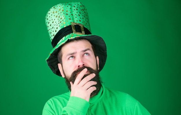 Saint patricks day holiday green part of celebration happy\
patricks day global celebration st patricks day holiday known for\
parades shamrocks and all things irish man bearded hipster wear\
hat