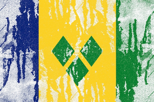 Photo saint vincent and the grenadines flag painted on old distressed concrete wall background