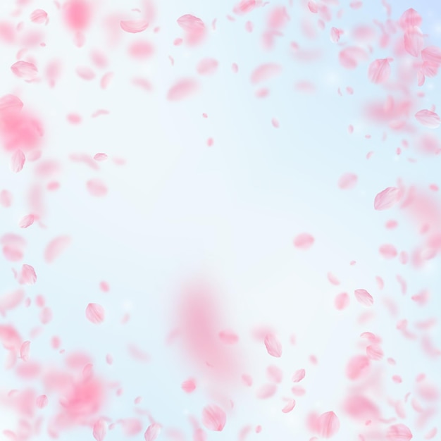 Photo sakura petals falling down. romantic pink flowers vignette. flying petals on blue sky square background. love, romance concept. fancy wedding invitation.