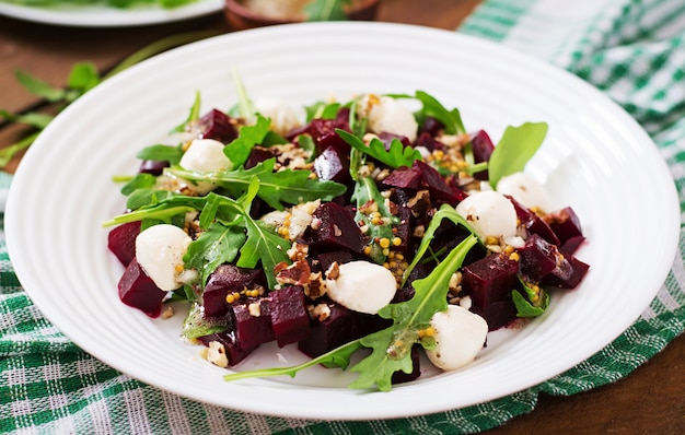 Salad of baked beets, arugula, cheese and nuts.