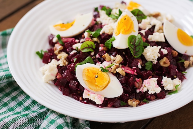 Salad baked beets, feta cheese, eggs, and walnuts