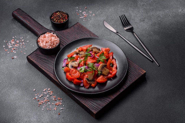 A salad of baked mushrooms tomatoes onions parsley spices and herbs