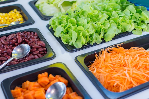 Salad Bar is a healthy food consists of various types of fresh vegetables sliced