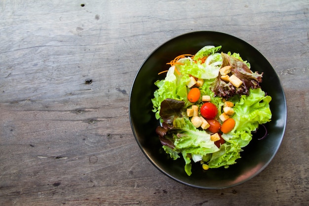 salad in black a bowl