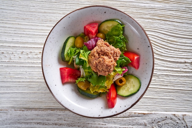 Salad bowl of tomato cucumber lettuce tuna