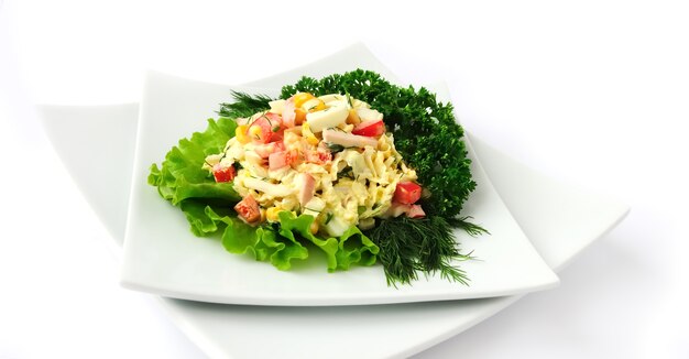 A salad of corn Chinese cabbage egg ham peppers and mayonnaise