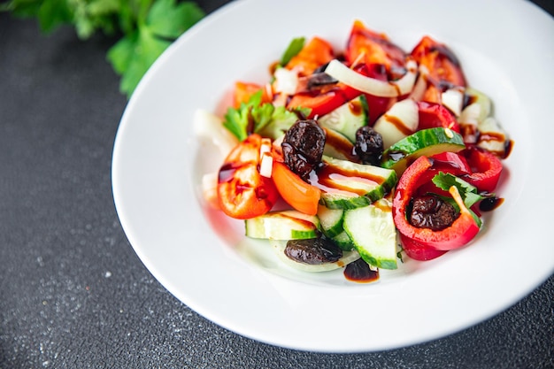 Salad dried olives and vegetables a la Greek salad healthy meal food snack on the table