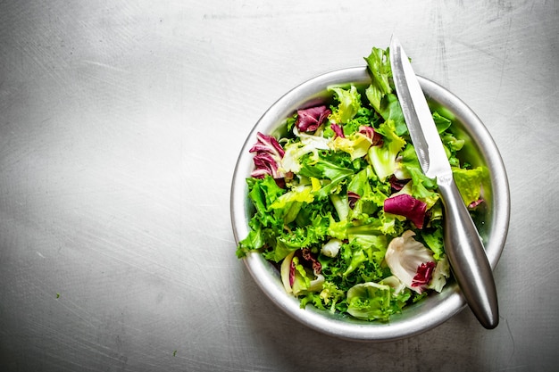 Salad of fresh greens in a bowl