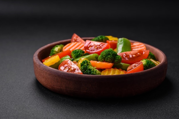 Salad of fresh and steamed vegetables cherry tomatoes broccoli and carrots