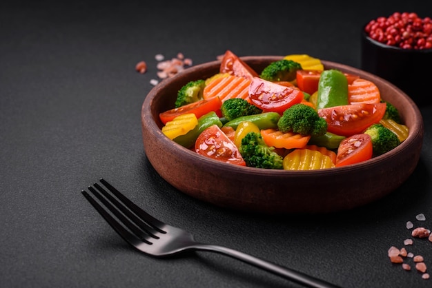 Salad of fresh and steamed vegetables cherry tomatoes broccoli and carrots