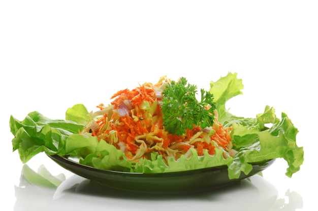 Salad from fresh vegetables on the white