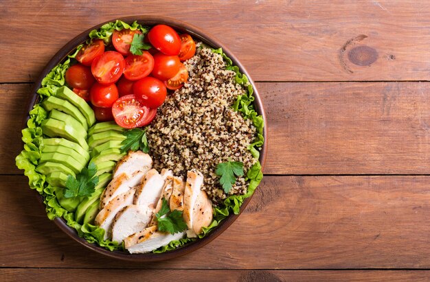 Salad from quinoa with avocado chiken and tomatoes