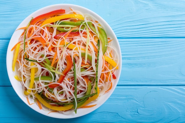 Salad from rice noodles with vegetables Asian food