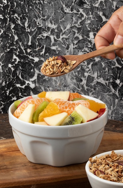 Salad of fruits with granola