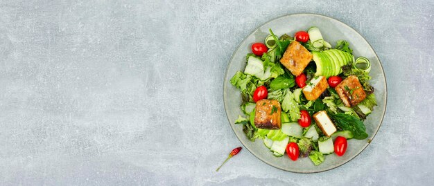 Salad of frying tofu and fresh vegetables