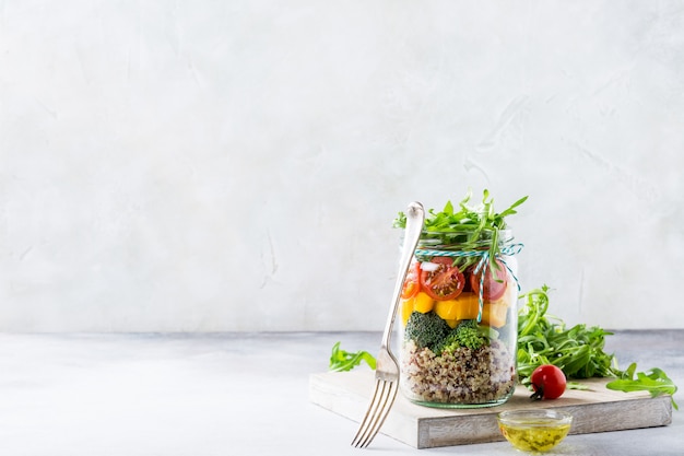 Salad in glass jar with quinoa