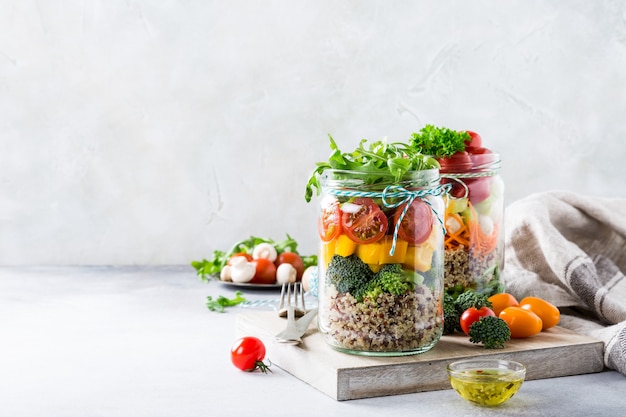 Salad in glass jar with quinoa