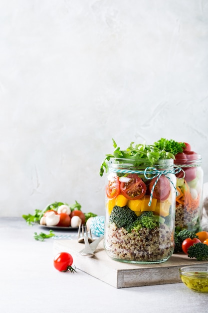 Salad in glass jar with quinoa