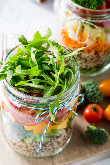 Salad in glass jar with quinoa