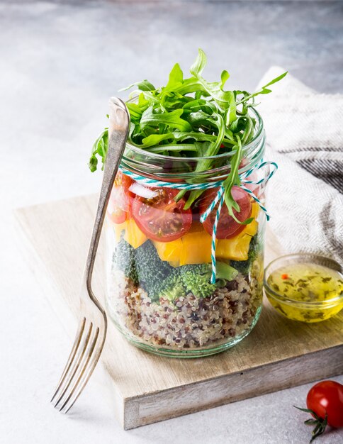 Salad in glass jar with quinoa