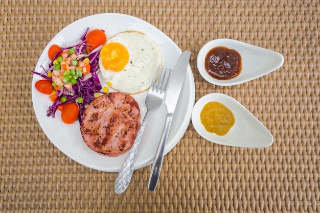 Salad and ham steak