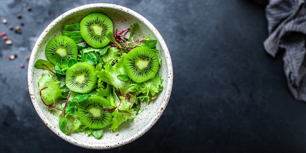 Salad lettuce and kiwi green mix leaves ready to cook and eat