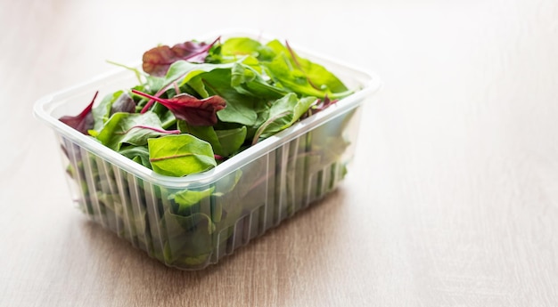 Salad mix in a box Fresh mixed salad leaves in plastic container